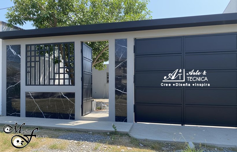 Instalación de portones automaticos abatibles y videportero en residencia en Managua, Nicaragua